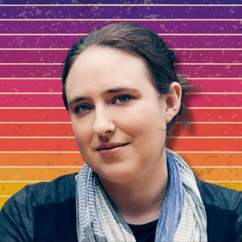 The author Amie Kaufman against a striped retro background.