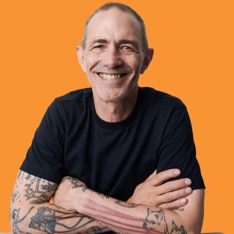 The author Andy Griffiths against an orange background